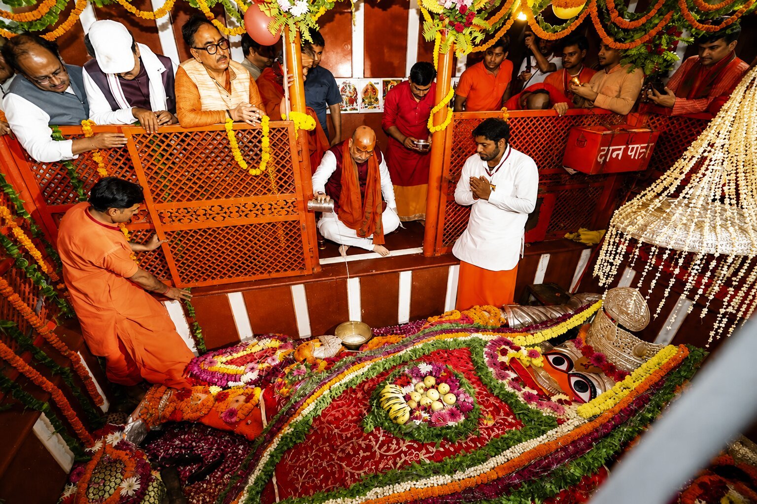 Hanuman Mandir — reclining Hanuman idol adorned with flowers during abhishek, Prayagraj